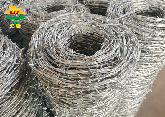 Hot Dipped 12 Gauge Galvanized Iron Barbed Wire On Fence Top