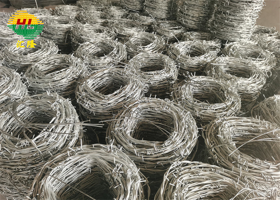 Hot Dipped 12 Gauge Galvanized Iron Barbed Wire On Fence Top